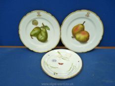 A pair of continental Plates with decoration of pears, rims and initials in gold,