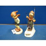 A Hummel figure of a Boy on skis and a young Boy standing in the wind.