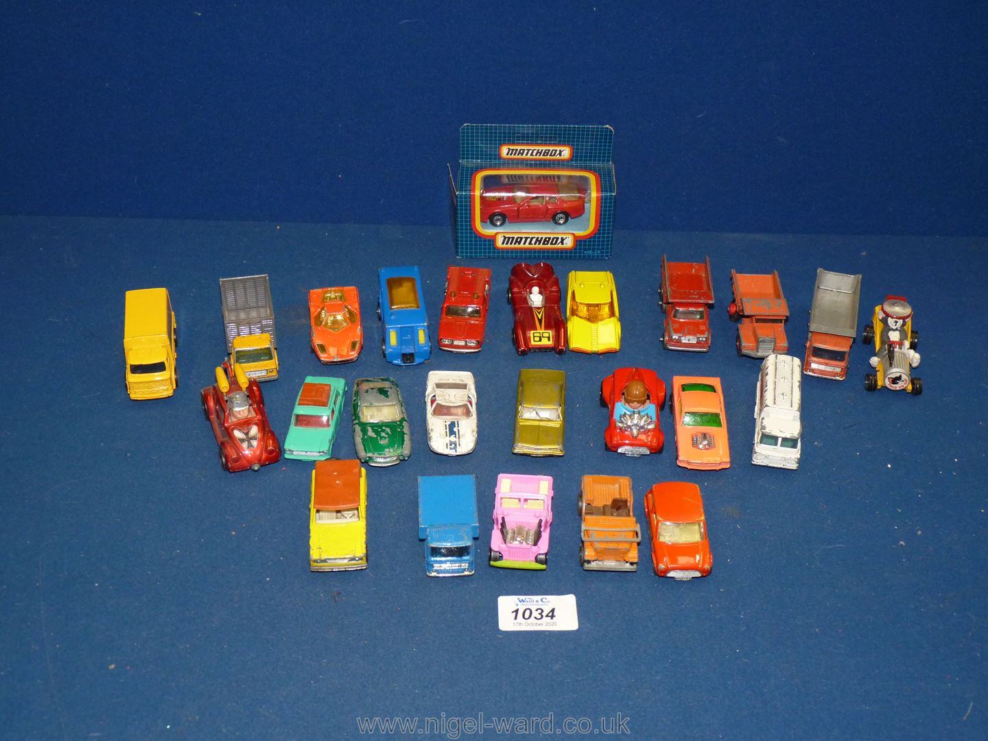 A quantity of small Matchbox vehicles including; racing cars, small lorries, a boxed Porsche 944,