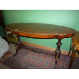 A fine Victorian Walnut hall/centre Table having a burr-wood top of lozenge shape raised on two