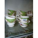 A Paragon Rockingham part tea service comprising cups, saucers, sugar bowl and milk jug.