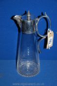 A Claret jug with silver plate top, handle and Bacchus faced lip.