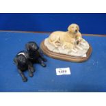 A Border Fine Arts yellow Labrador with her puppies on a loose base,