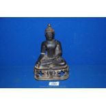 A bronze Buddha. 8 1/2" tall.