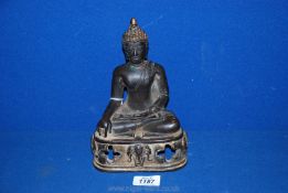 A bronze Buddha. 8 1/2" tall.