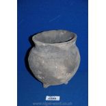 A Chinese late Neolithic/early Bronze Age ribbed jar on small tripod feet,