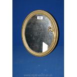 A brass Art Deco style standing mirror, having a lady to the side of the frame. 14" x 11".