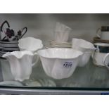 A part Shelley Teaset in white including five saucers, six cups, six tea plates,