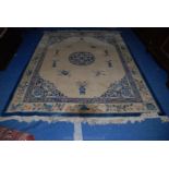 A Chinese bordered and fringed Rug, the border depicting flowering stems and pairs of Carp,