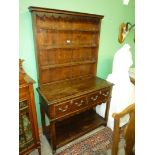 An appealing compact Oak pot board Welsh Dresser having fretworked frieze and apron,