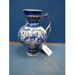 An attractive 19th century blue Westerwald renaissance style jug with mask and coat of arms in