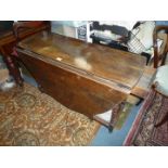 A good heavy period Oak dropleaf, swing leg peg joined Dining Table standing on turned legs,