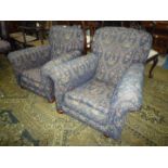 A pair of circa 1910 lady's and gent's fireside Chairs re-upholstered in navy blue and beige fabric