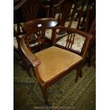 An Edwardian Mahogany elbow Chair having bowed arms and back with boxwood strung detail,