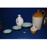 A large Stoneware flagon, three graduated blue and white Victorian Ironstone fish moulds,