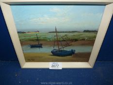 A small Oil on board depicting a small inlet with two boats, signed lower left John Tuck,