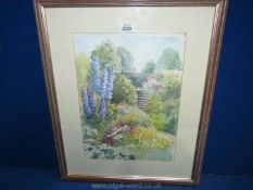 A framed and mounted Watercolour depicting a garden scene, unsigned.