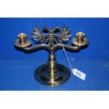 A brass double headed Eagle Candlestick. 8 1/2" tall.