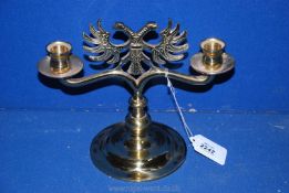 A brass double headed Eagle Candlestick. 8 1/2" tall.