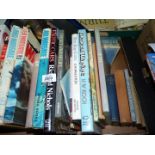 A box of hardback books including Cricket, Exotic cars, Warfare, etc.