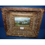 A gilt framed Oil painting of a chariot and horses.