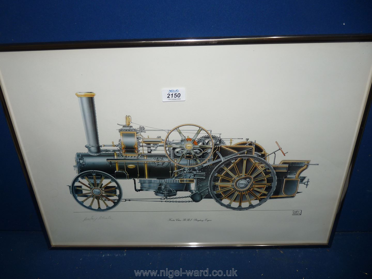 A framed Print depicting Fowler Class Ploughing Engine signed in pencil Geoffrey Wheeler