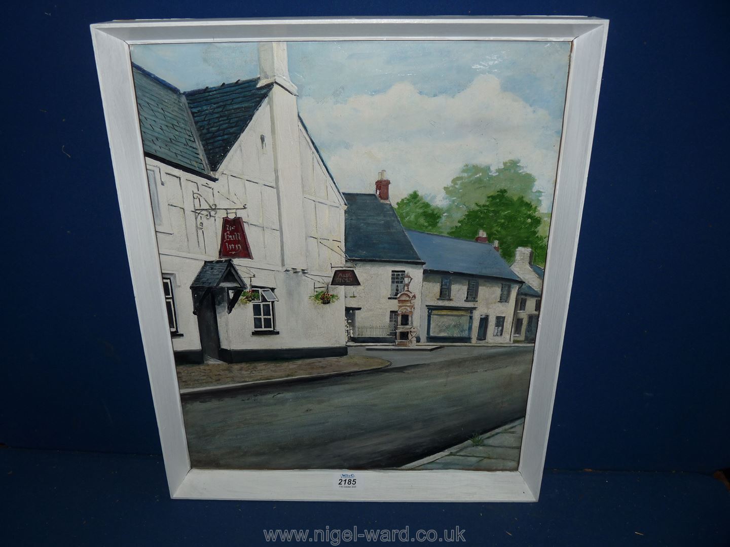 A large painted wooden framed Oil on canvas depicting "The Bull Inn, Caerleon", 13'' x 22''.