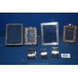 Four silver frames, three napkin rings (66 gms), all hallmarked.