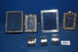 Four silver frames, three napkin rings (66 gms), all hallmarked.