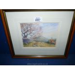 A small framed Watercolour of a country landscape with mountain in distance, signed lower left K.