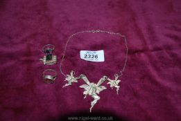 A vintage silver plated fairy necklace, silver rings, etc.