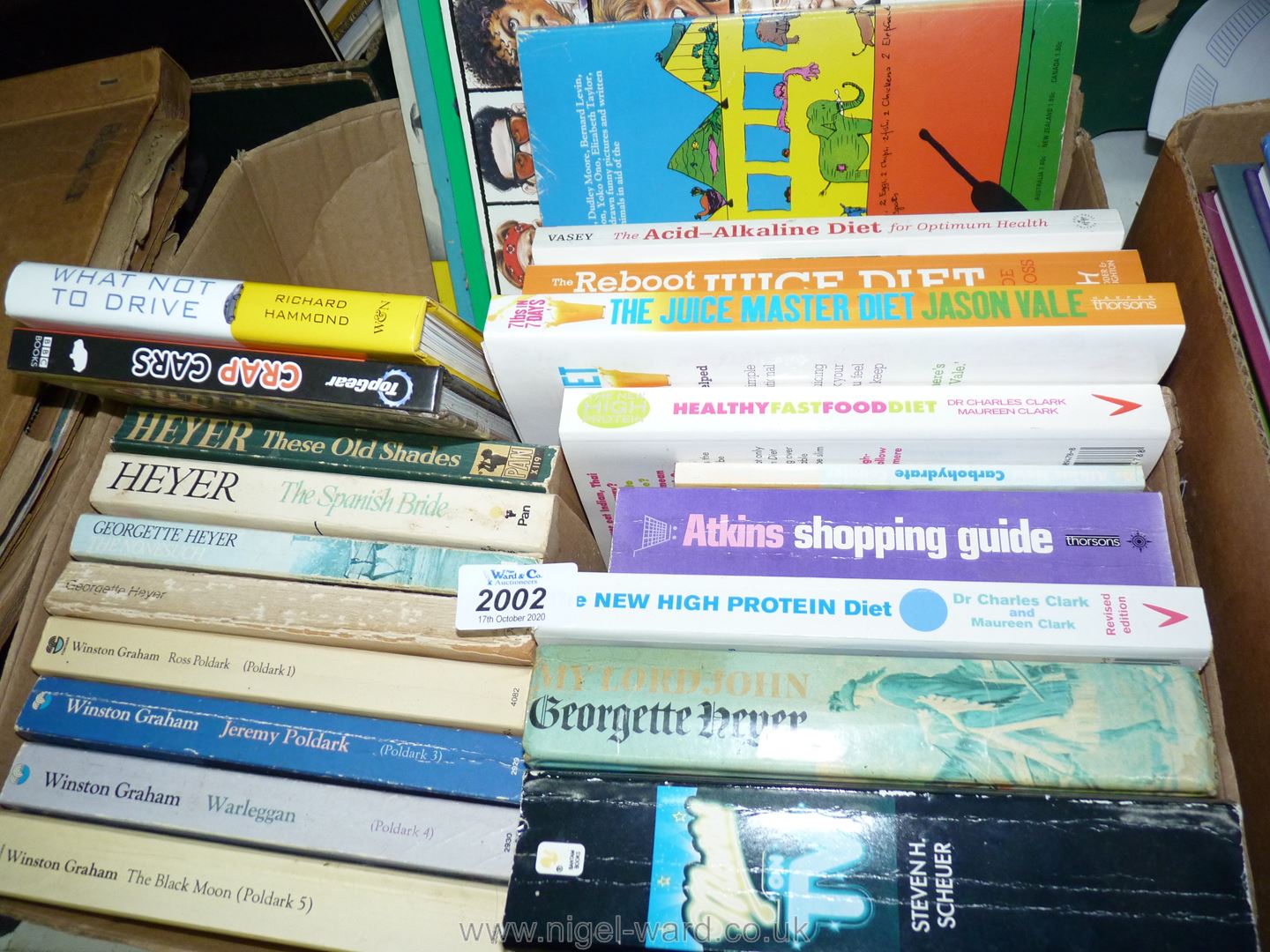 A box of books on Healthy Eating and Winston Graham novels