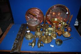 Two brass candle sticks c. 1910, two copper chamber sticks c.