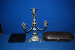 A set of silver handled knives, a case for a silver ladle and plated candelabrum.