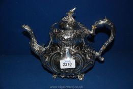 An ornate plated Teapot with eagle spout and finial,