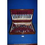 A wooden cased canteen of plated cutlery, six place and including a carving knife and fork,