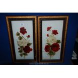 Two ornately framed Paintings on glass depicting red and white flowers