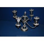 A plated four branch candelabra with centre holder and stopper, 10 1/2" tall.