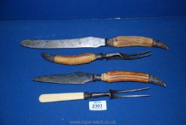 A horn handled Carving set with Sheffield silver ends, plus one other fork.