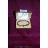 A 9 ct. gold gate Bracelet with heart shaped padlock and safety chain.