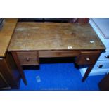 An Oak lowboy/work desk with a drawer either side of the kneehole.