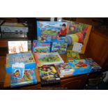 A box of children's games and puzzles including Paw Patrol Game and Giant Floor Puzzle,