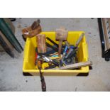 A tub of hand-tools including braces, a mallet, a block plane, a spirit level, etc.