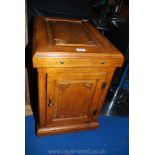 A contemporary single-doored hardwood Cupboard with panelled top. 16'' wide x 23'' deep x 23'' high.