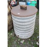 A Corrugated circular feed bin/water butt with lid & hole for a tap.