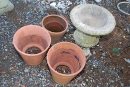 Concrete urn style planter, 19'' high, three terracotta pots,