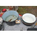 Two Cast iron cooking pots.