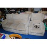 A beige upholstered three seater settee and a matching electrically-adjusting chair.