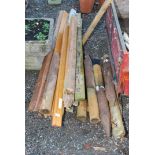 A quantity of used timber and short stakes.