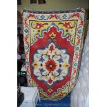 A colourful vintage "Readicut" hearth rug.